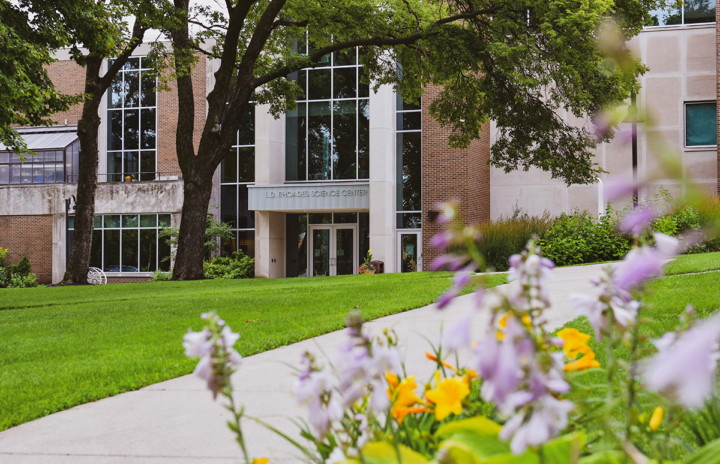 Rhoades Science Center with flowers in foreground