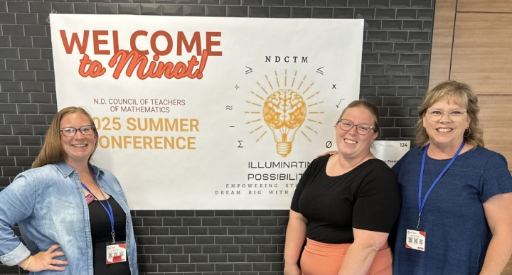 Harmony Richman, Jessica Haut, Joan Klein in front of signage for conference