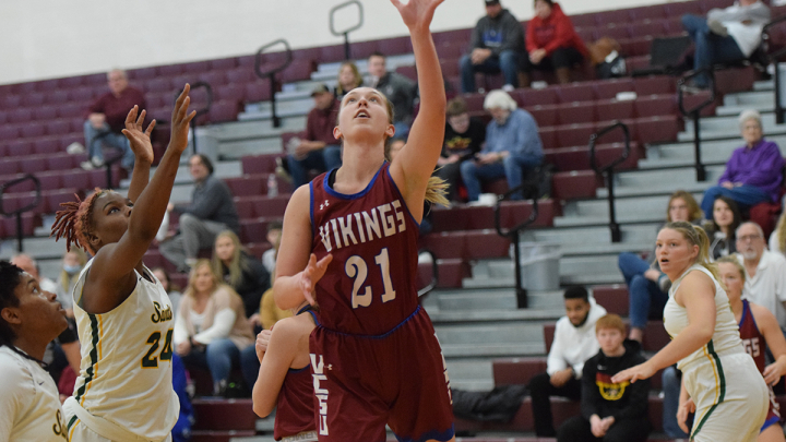 female playing basketball