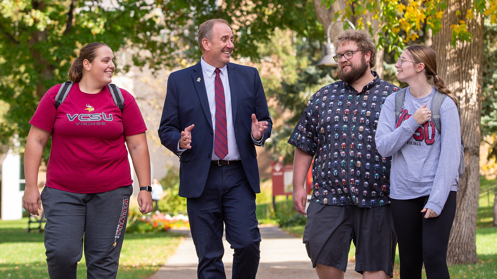 VCSU president Alan LaFave talks with a group of students on campus