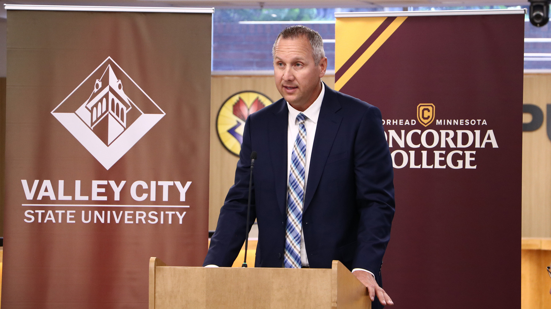 Josh Johnson delivers remarks at a podium