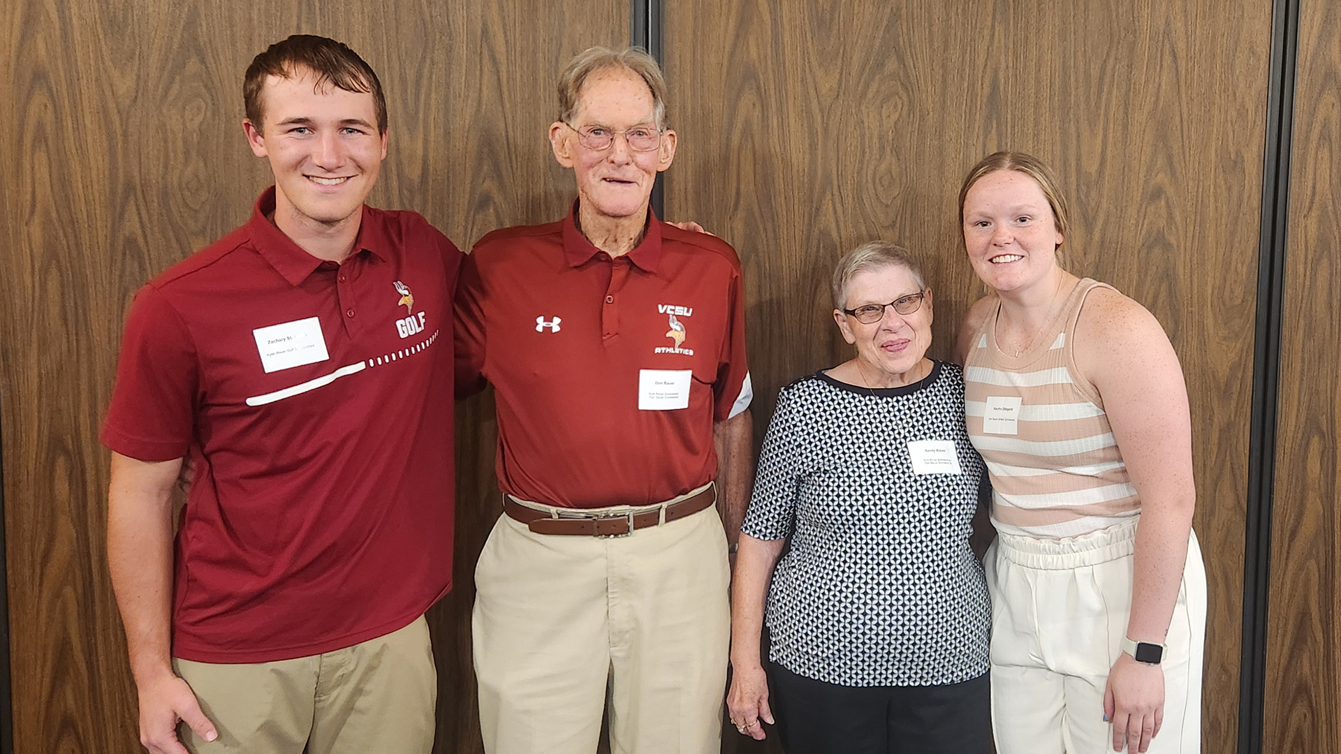 VCSU scholarship donors Don '63 and Sandy Bauer stand for a photo with scholarship recipients Zachary St. Aubin and Kendra Odegard.
