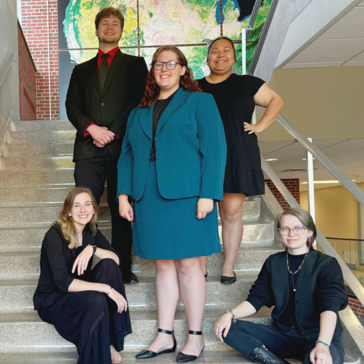 VCSU Speech Team members gather on steps at a recent tournament.