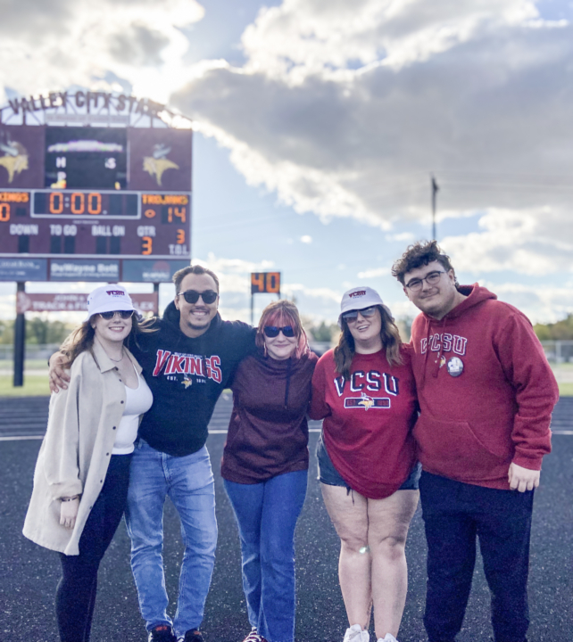 Grace Reep alongside four VCSU students smiling at the camera