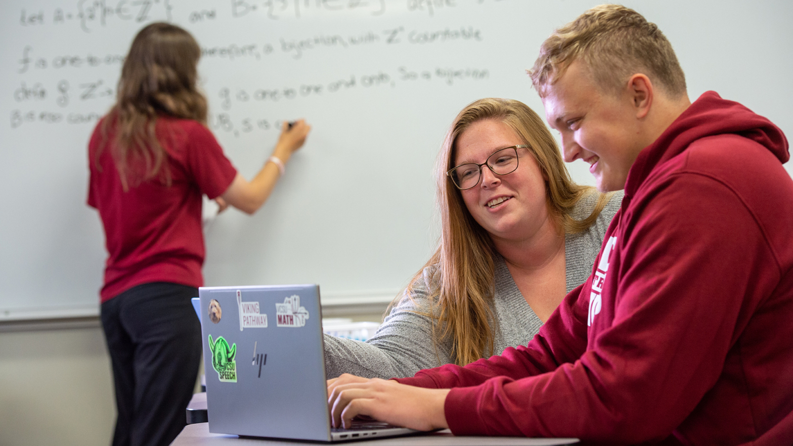A VCSU professor gives 1-on-1 instruction to a student