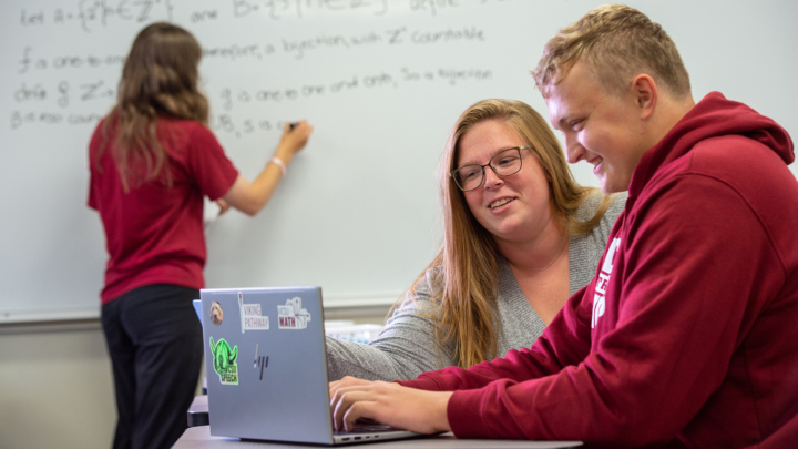 A VCSU professor gives 1-on-1 instruction to a student