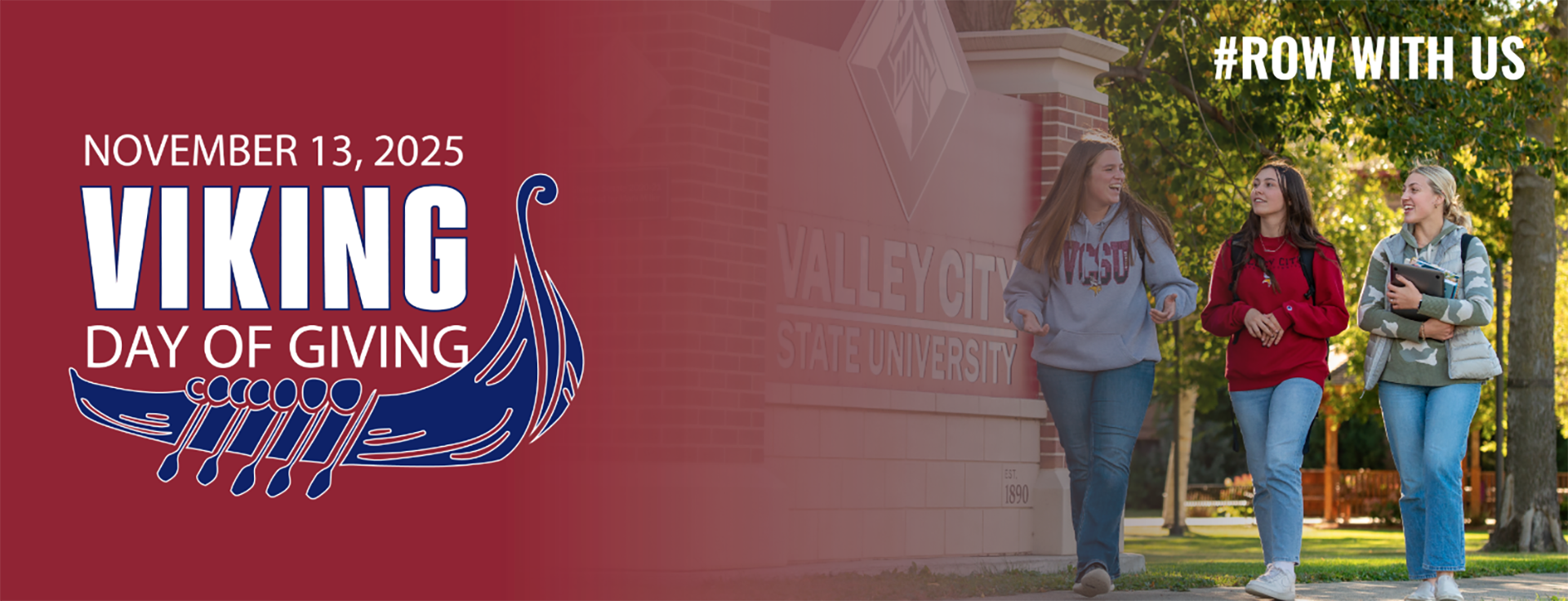 3 students walk on campus in front of a sign that says Valley City State University.