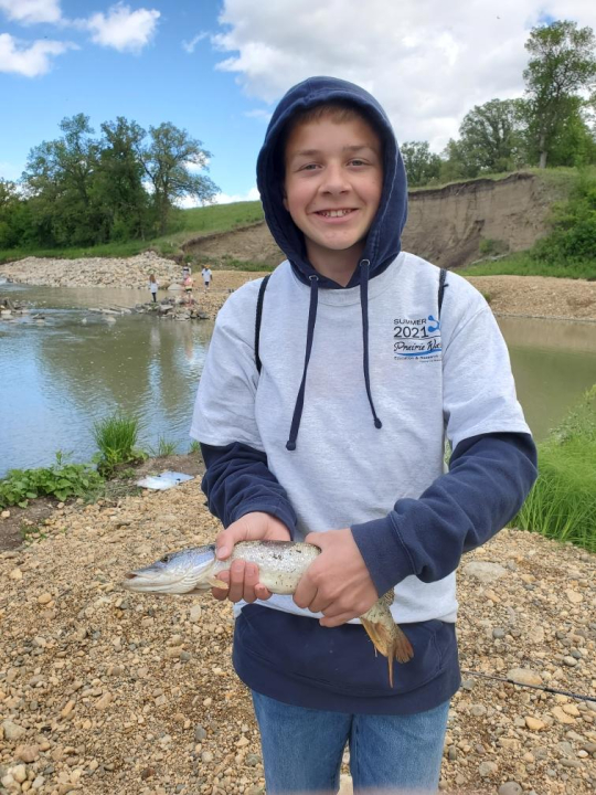 camper holding fish