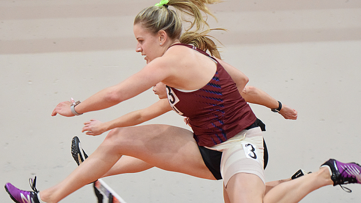 track and field jumping over hurdles