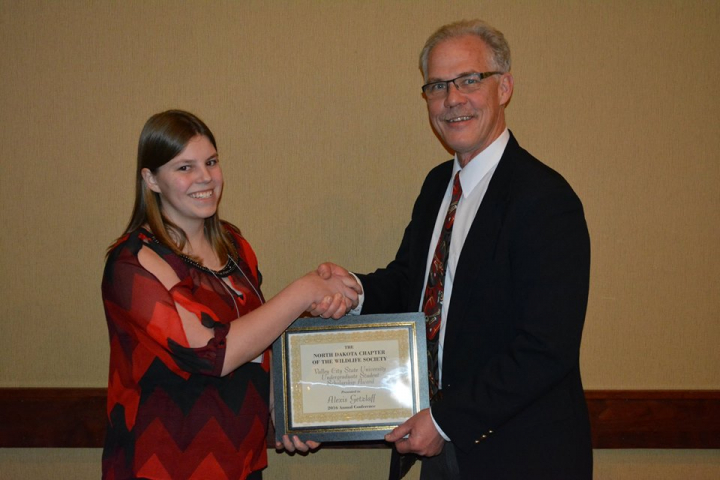 Student receiving scholarship award