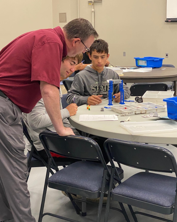 Jason Dockter helping students