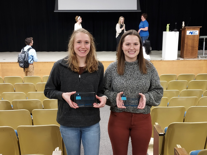 Juarez and Roscoe holding awards