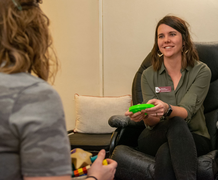 Counselor Kelsie Carter talks with a client in the counseling office at Valley City State University