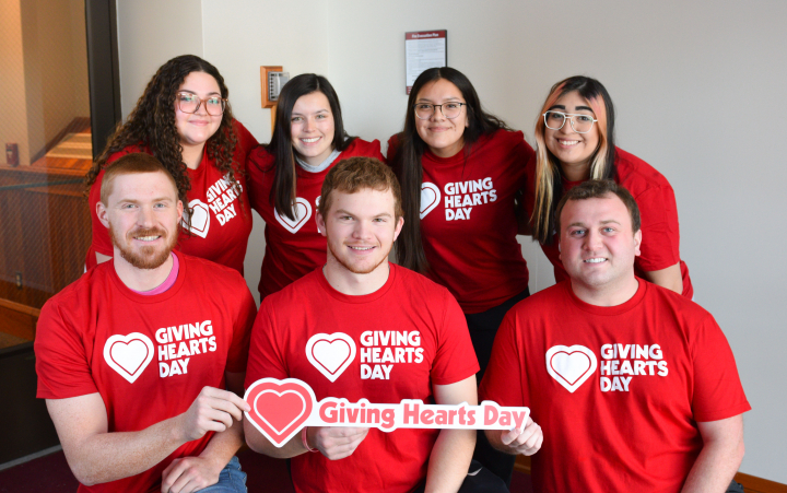 group of students wearing Giving Hearts Day shirts