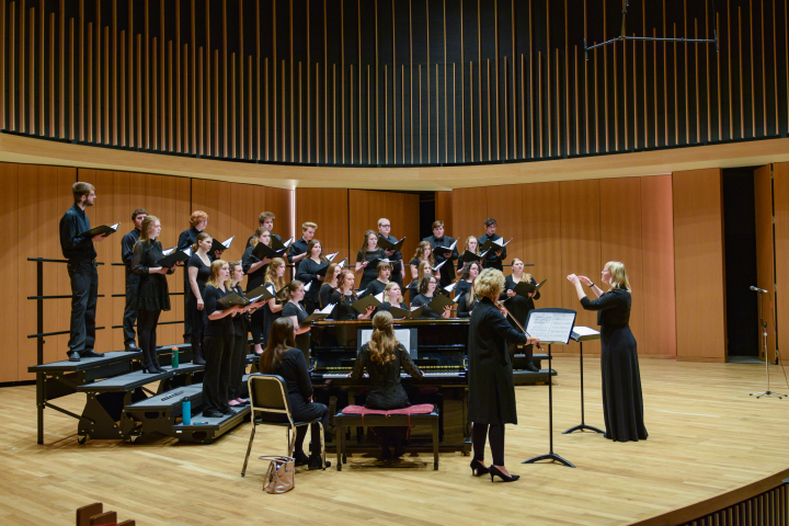 Choir performing in performance hall