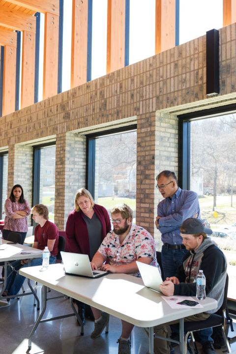 Students show their server project to software engineering faculty