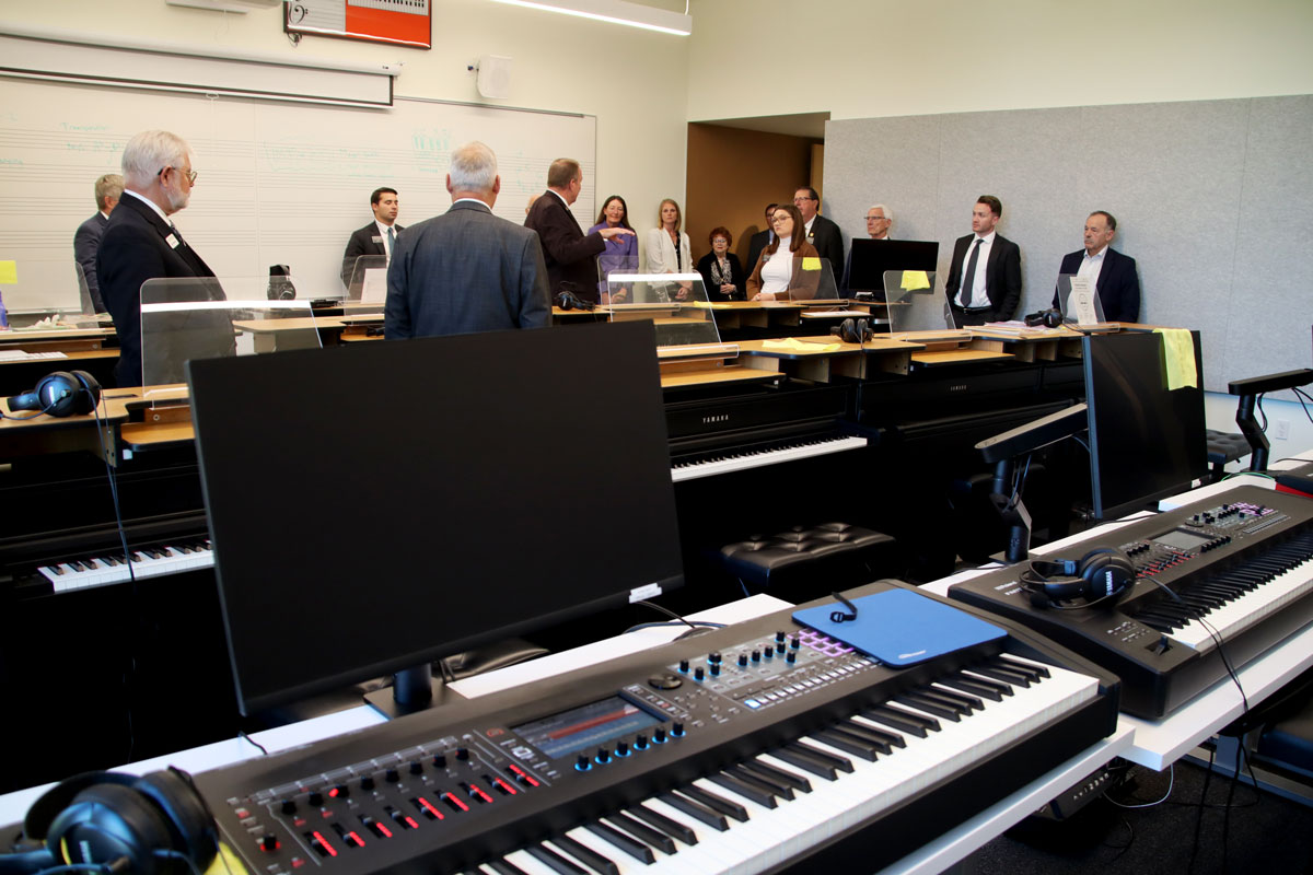 Members of the North Dakota Legislature visit the piano lab at Valley City State University.
