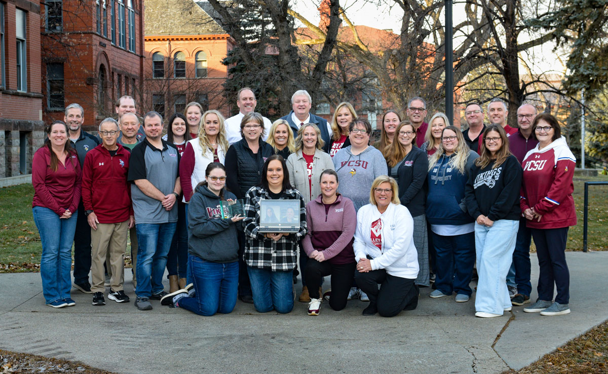 Members of the School of Education pose with the award from CAEP