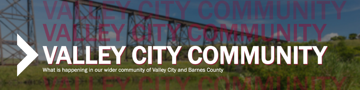 A backdrop featuring the HiLine bridge and a white chevron with the text Valley City Community