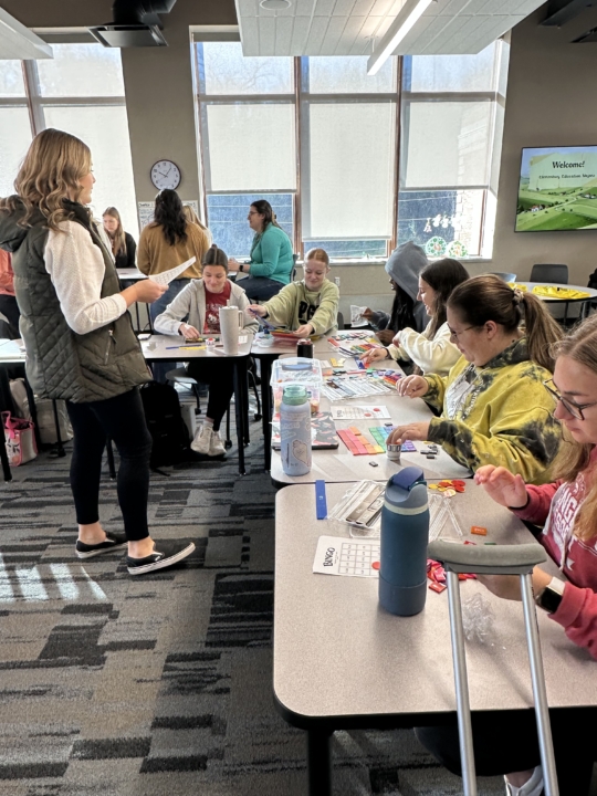 students working on project at tables in classroom