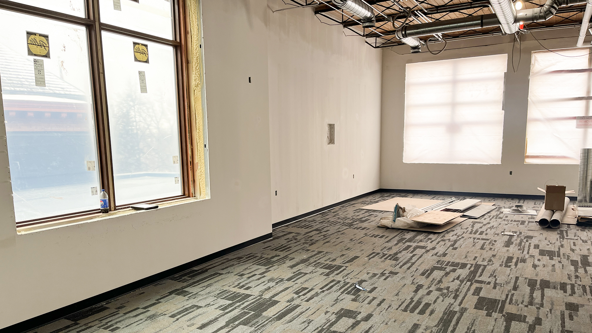 A 3rd floor classroom shows newly installed windows and fresh carpet