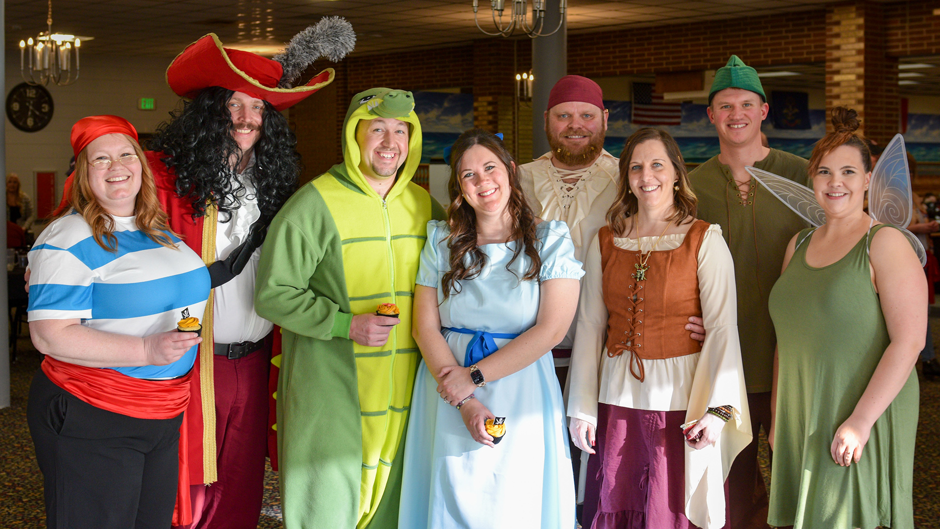 Attendees at the scholarships auction are dressed as characters from Peter Pan