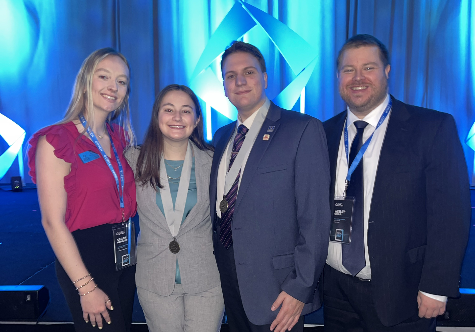 VCSU students Sarah Monilaws, Jalynn Anderson, and Matt Belgarde, and professor Wesley Wright are pictured at the Collegiate DECA International Career Development Conference in San Francisco. 