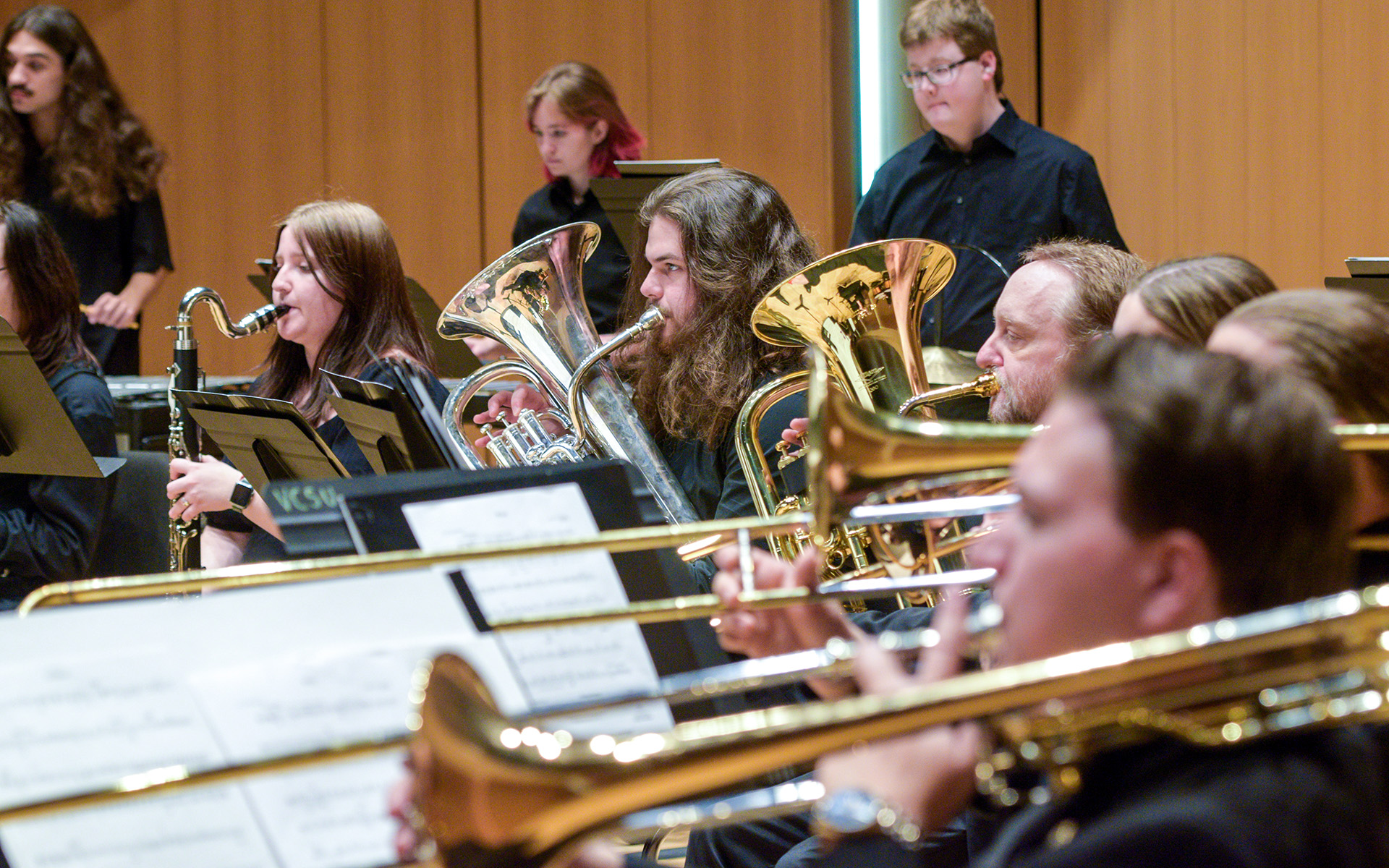 VCSU students play brass instruments during a rehearsal