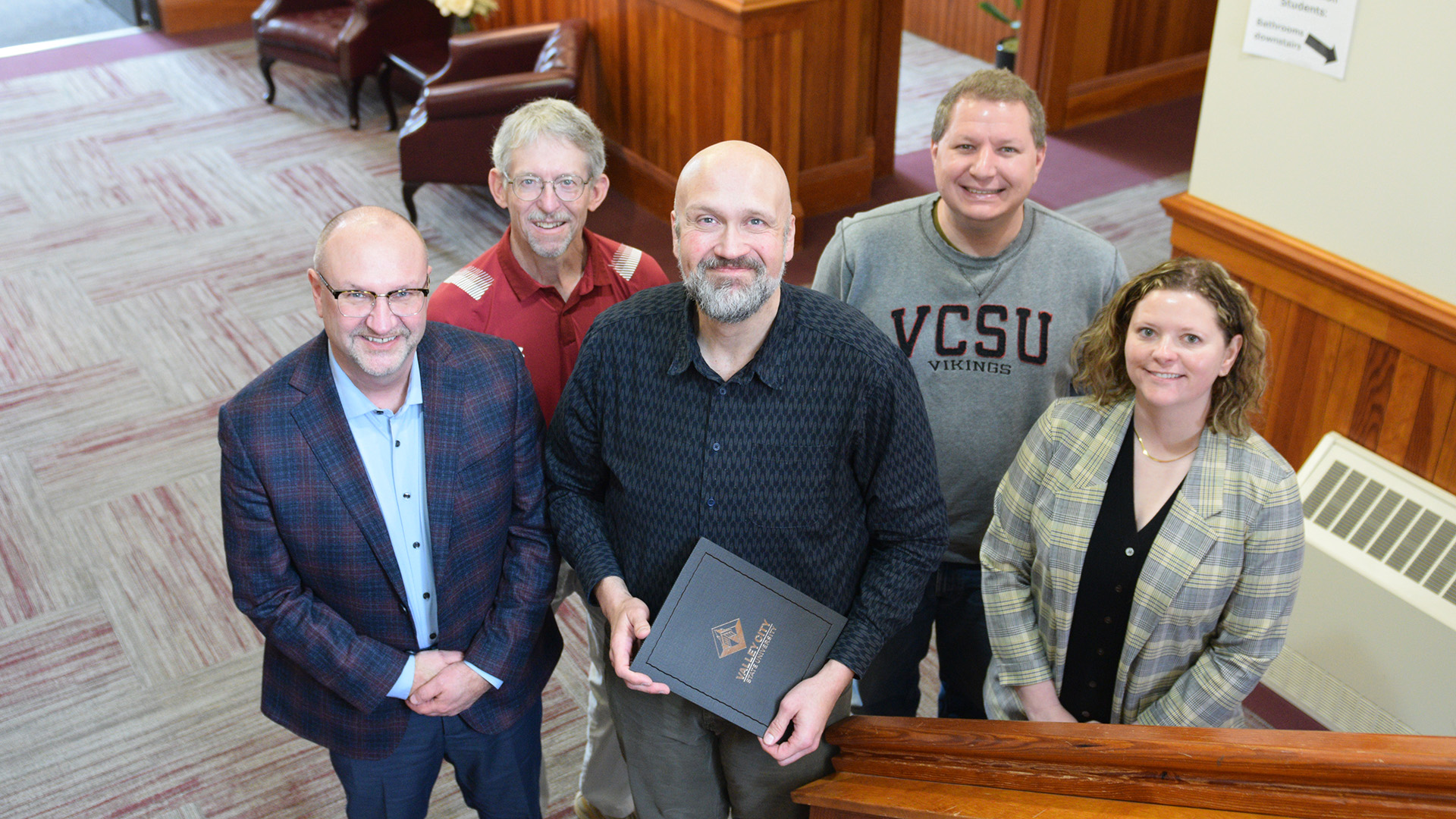VCSU faculty Dr. Anthony Dutton is pictured with VCSU administrators and employees from the social science department.