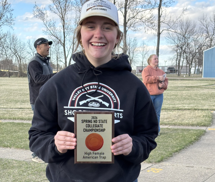 Gretchen holding award