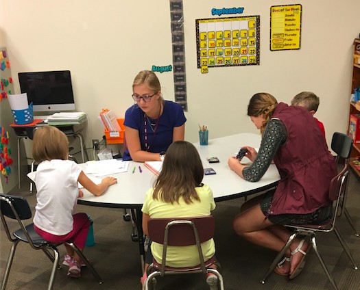 VCSU Substitute Teacher Program participants Laken Breuer (center) and Darika Lemna served as student performance strategists while subbing at Jefferson Elementary in Valley City.