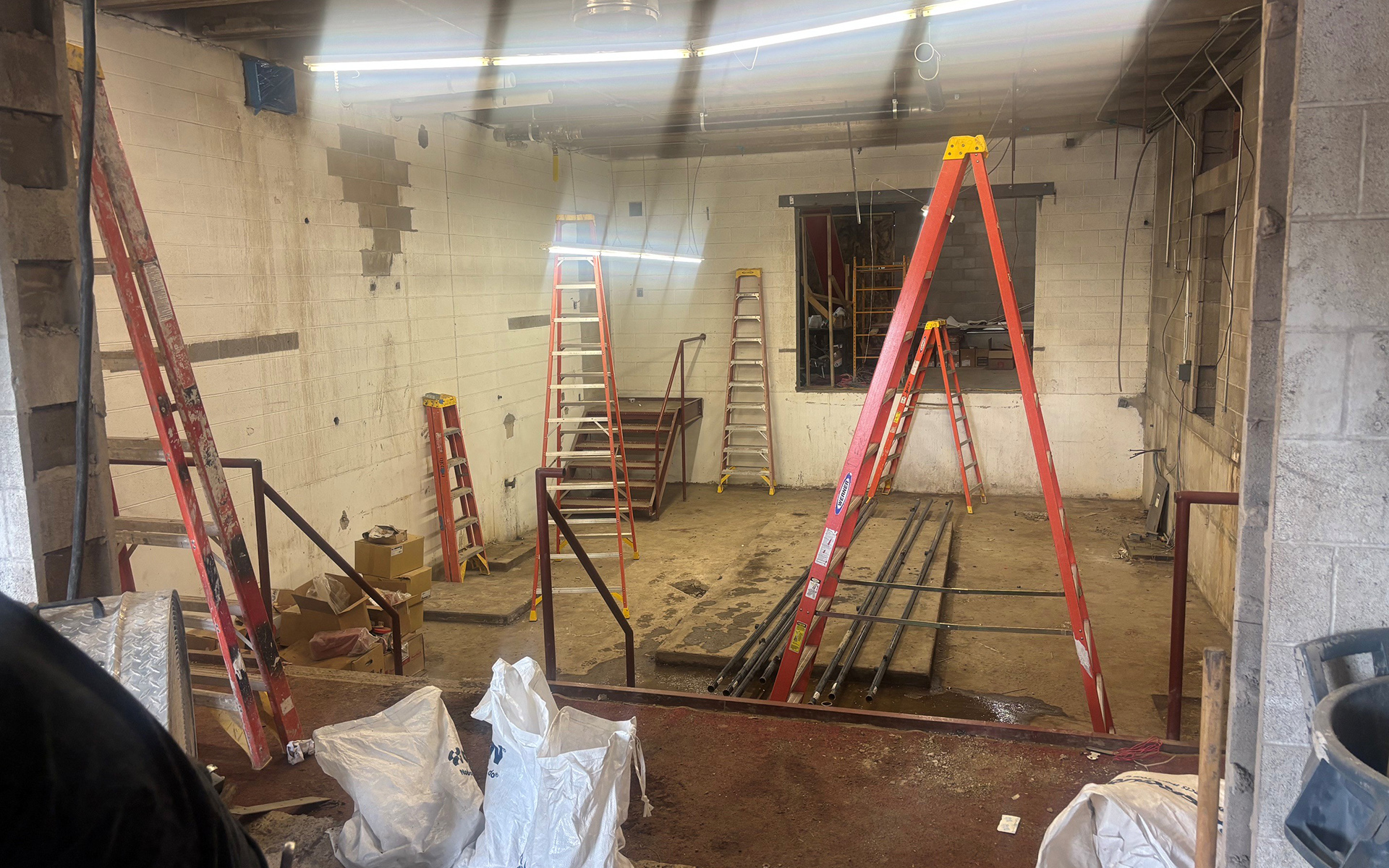 Ladders and construction equipment are shown inside the old boiler room at VCSU's W.E. Osmon Fieldhouse.