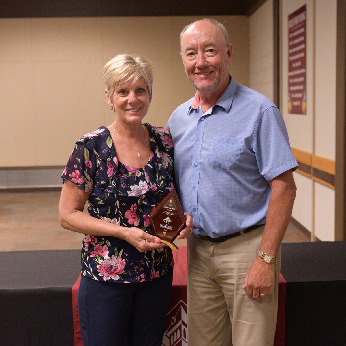 Coleen and Rick Asche hold a crystal donor award