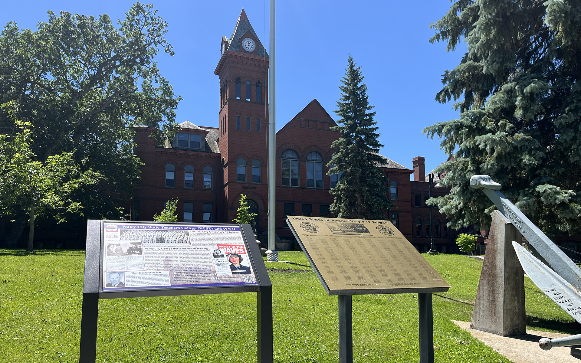 An interpretive panel is installed on the green lawn in front of VCSU's McFarland Hall.
