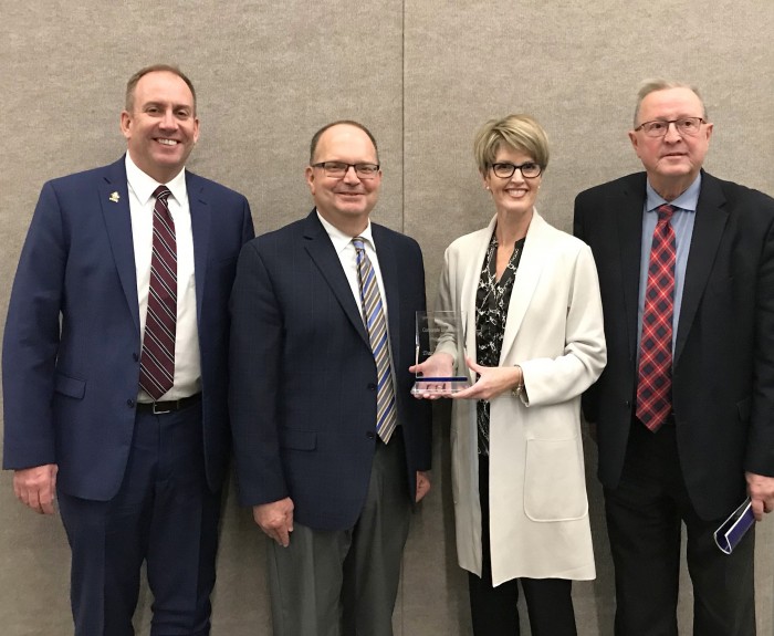 Dacotah Bank’s Mark Oberlander (second from left) and Paige Bjornson are pictured at the National Philanthropy Day Awards Luncheon in Fargo with VCSU President Alan LaFave (left) and Larry Robinson, VCSU executive director of advancement (right).