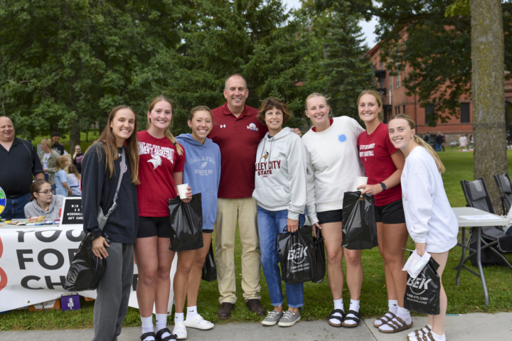 President Alan LaFave and wife Kari pose with VCSU student at the VCSU Marketplace