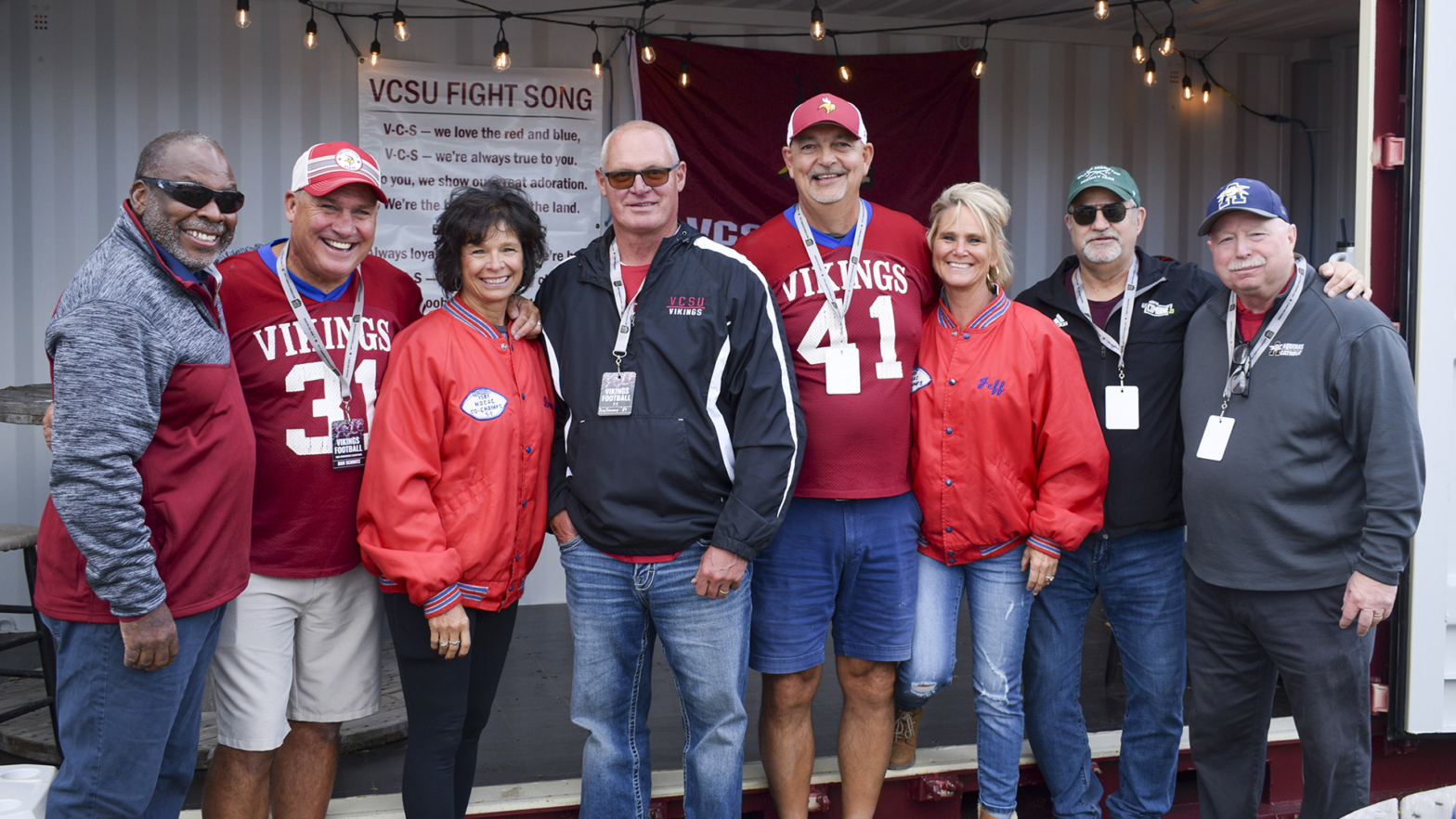 VCSU Alumni share smiles and laughs while watching a VCSU Football game.