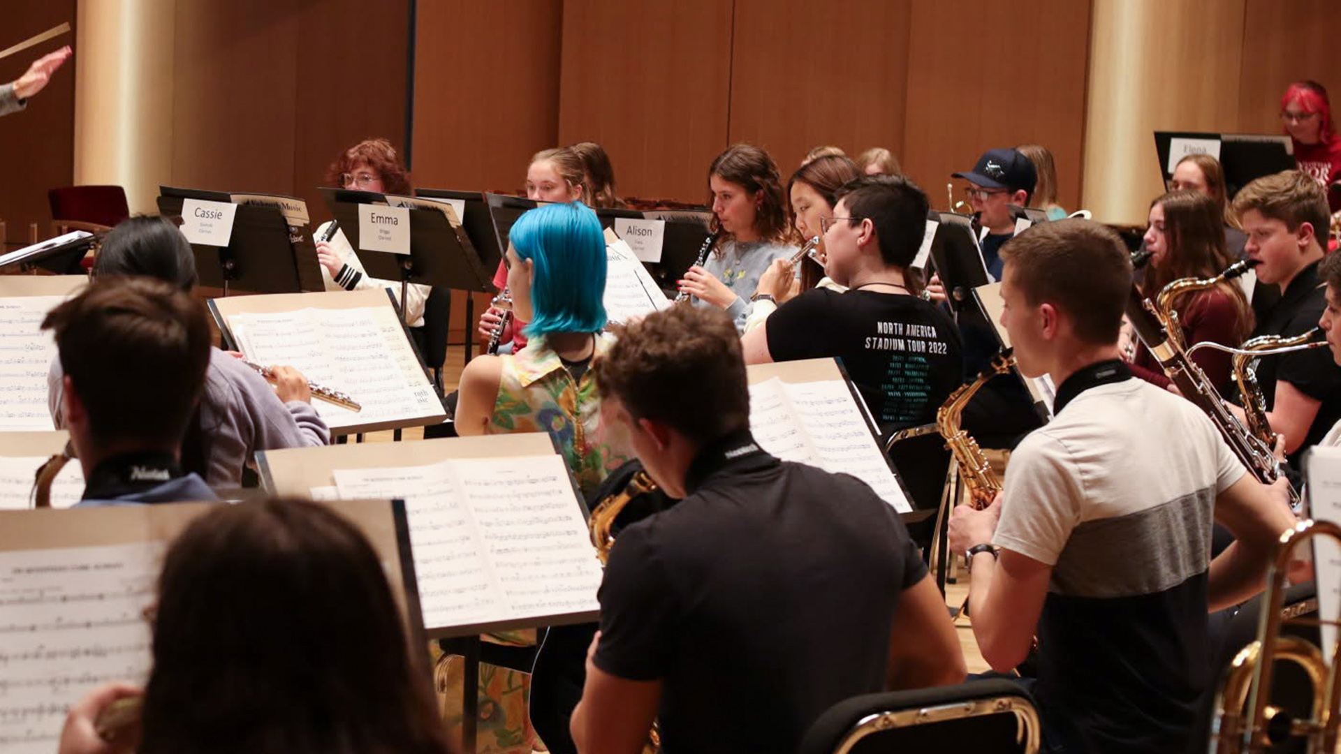 High school students play instruments during a rehearsal session for Ployhar Honor Band