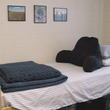 A moving gif of a single-bed room in Robertson Hall at Valley City State University