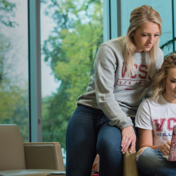 Two girls looking at a laptop