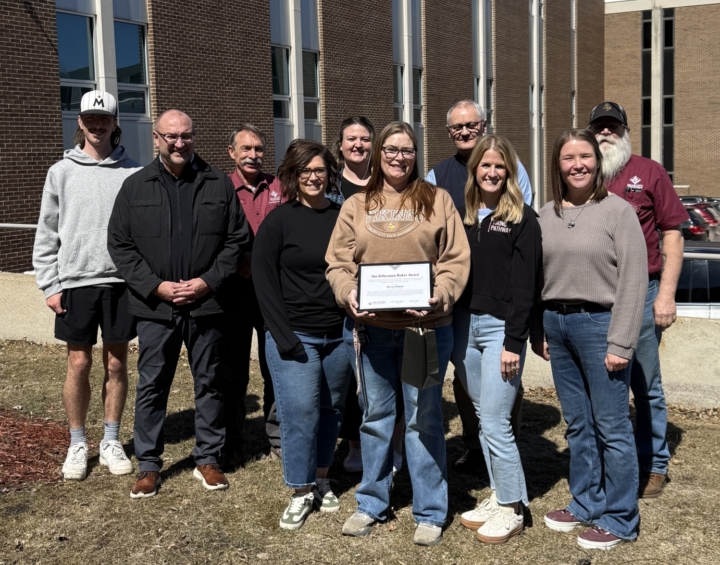 Mindy receiving award from colleagues