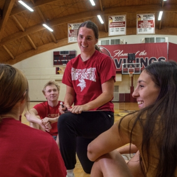 Ashlyn coaching a group of students