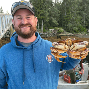Bryan Delaney with a crab in Alaska