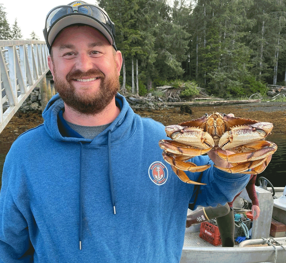 Bryan Delaney with a crab in Alaska