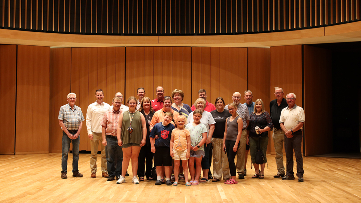 Kiwanis group posing in Center for the Arts