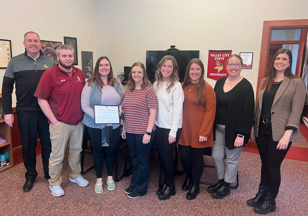 KaSaundra Peterson receiving award from colleagues