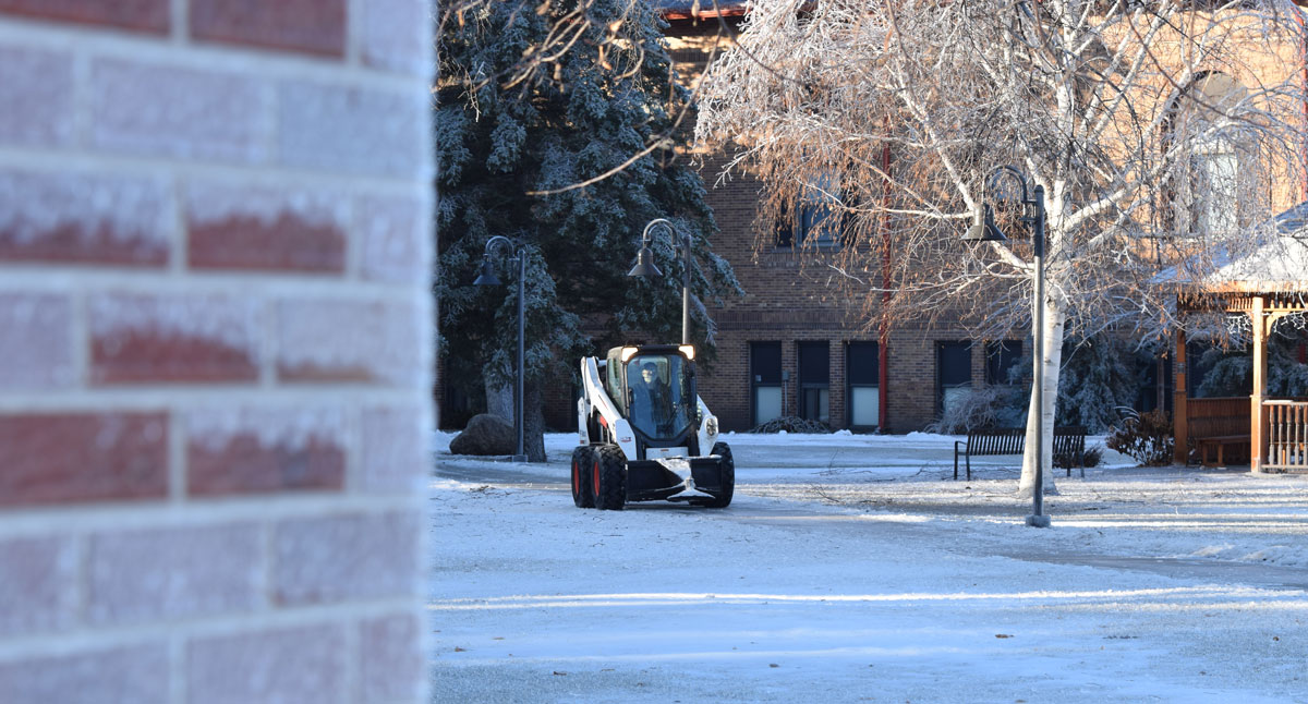 VCSU Facilities Services staff work to cleanup campus after an ice storm. 