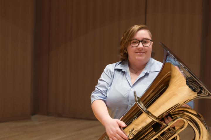 portrait of Heather Lewis holding tuba
