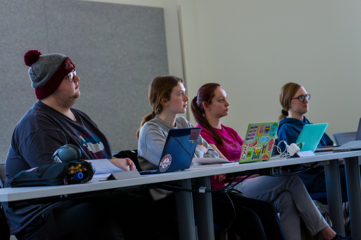 Students listening to professor