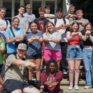 large group of students smiling at camera